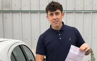 Alex from Holyhead at Bangor Driving Test Centre with his part 3 pass 