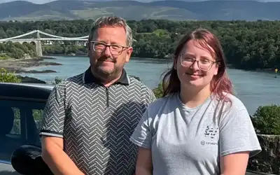 Gregor Hackett driving instructor from Anglesey with Menai Bridge in the background